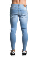 Calça jeans longa moda masculina desfiada slim fit