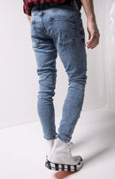 Calça jeans longa moda masculina desfiada slim fit