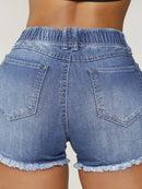 Shorts jeans rasgados com cordão feminino